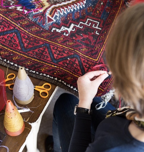 Jilli sewing the carpet